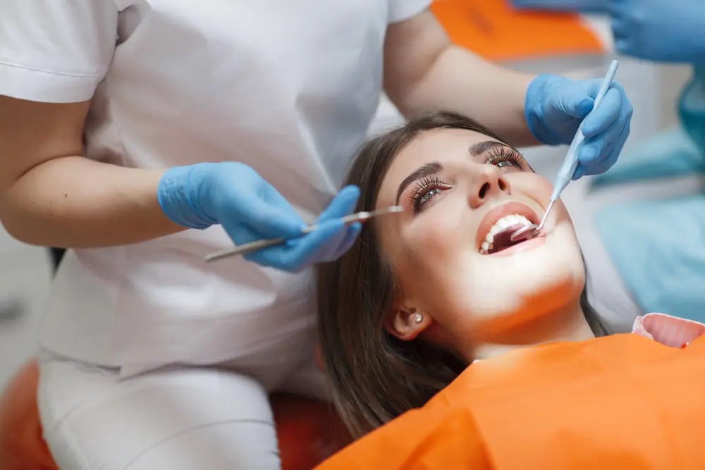 woman getting teeth examed