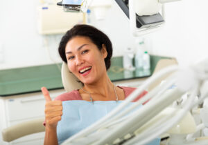 woman happy with dental care laser dentistry concept