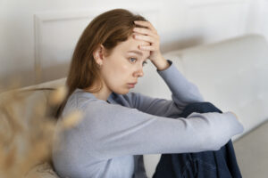 https://www.freepik.com/free-photo/anxious-woman-sitting-couch-side-view_27830418.htm Worried woman with hand on her head 